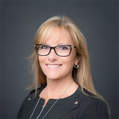 A headshot of Dr. Melanie Parker, an orthodontist of Melanie Parker Orthodontics.